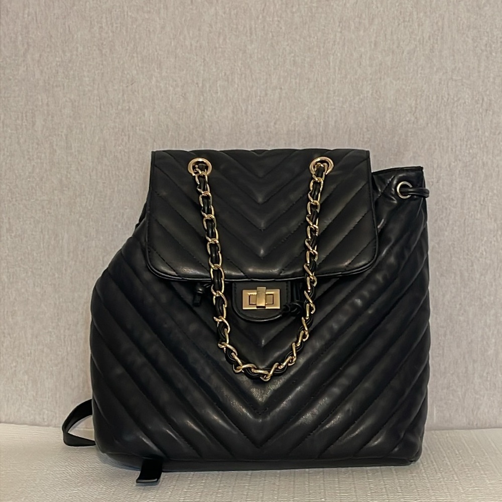 No brand, quilted, backpack/ hand bag.